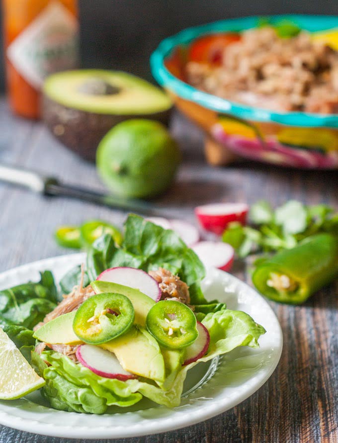 These slow cooker pork carnitas lettuce wraps are a great low carb dinner that take minutes to make. Get the slow cooker ready the night before and have diner on the table in 5 minutes!
