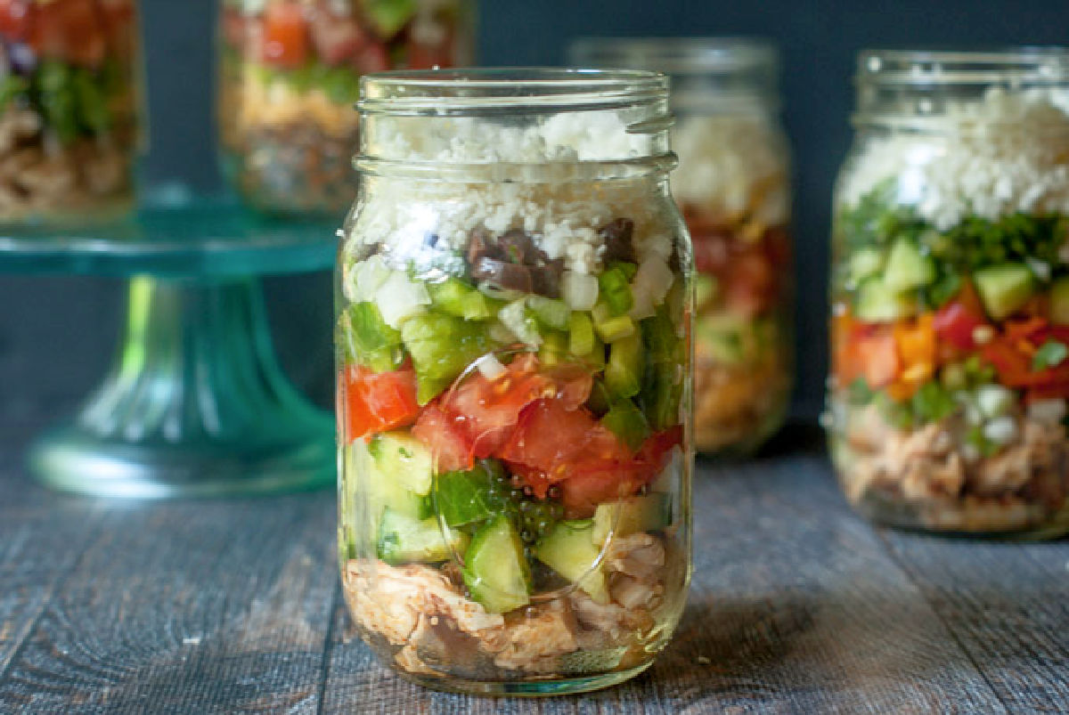 Closeup of a low carb Greek salad meal prep jar.