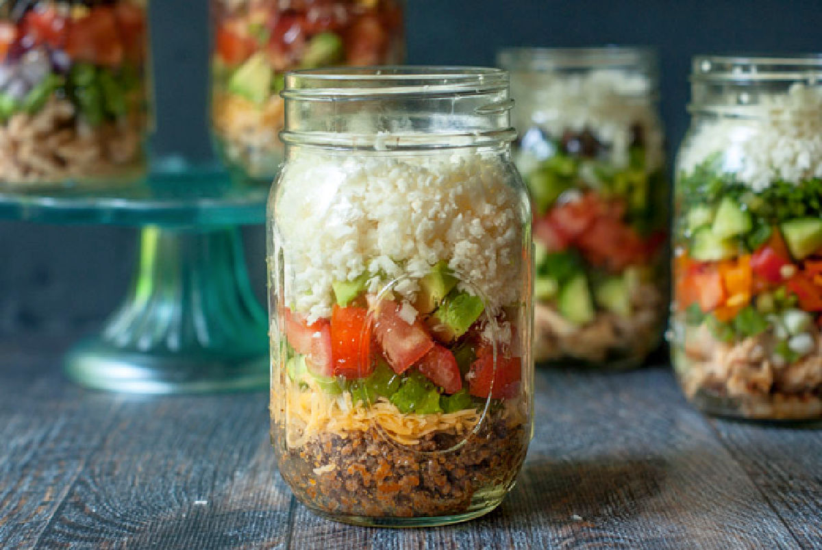 Closeup of a Mexican taco salad meal prep jar.