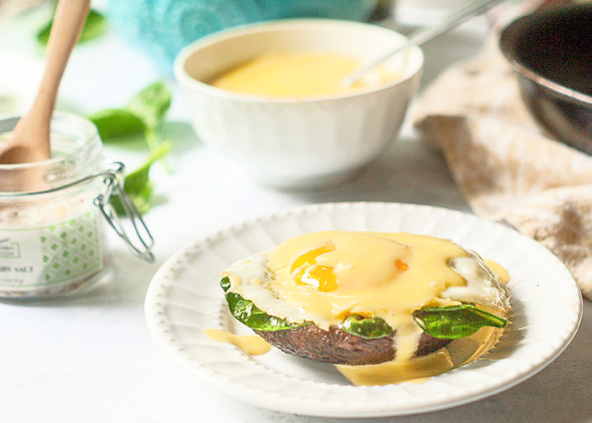 Portobello Eggs with Hollandaise Sauce - low carb breakfast, lunch or dinner! Closeup of a serving of the finished dish.