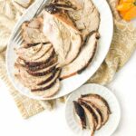white platter with sliced smoked turkey breast with text overlay