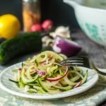 These lemon ginger Asian cucumber noodles make a refreshing salad that you can make in minutes. These cucumber noodles are perfect for picnics or even a light dinner. Best of all those huge cucumbers from the garden work great in this dish!