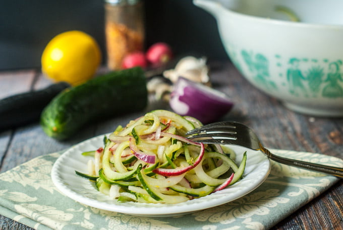 These lemon ginger Asian cucumber noodles make a refreshing salad that you can make in minutes. These cucumber noodles are perfect for picnics or even a light dinner. Best of all those huge cucumbers from the garden work great in this dish!