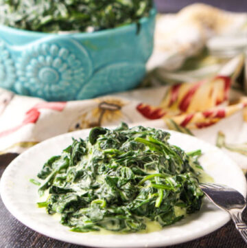 white plate with low carb slow cooker creamed spinach