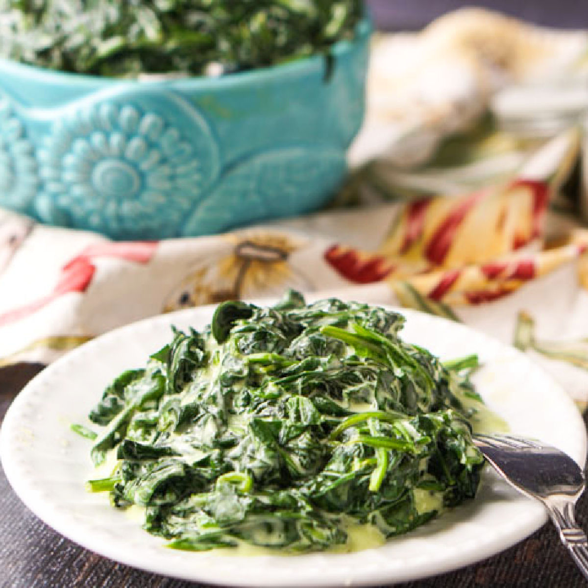 white plate with low carb slow cooker creamed spinach