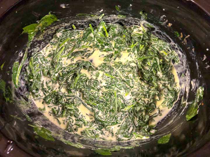 finished keto creamed spinach in the slow cooker