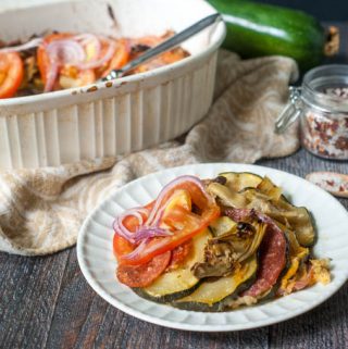 This garden zucchini antipasto casserole is the perfect dish to make with all of those huge zucchini you get from your garden this summer. Layers of zucchini, meats and cheeses are topped with artichokes, tomatoes and onions.
