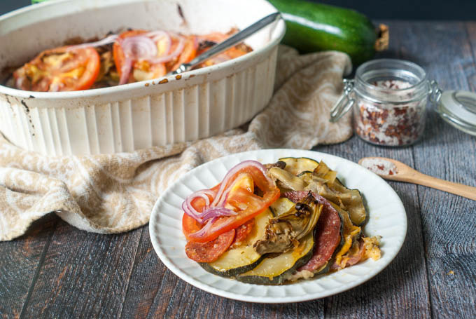This garden zucchini antipasto casserole is the perfect dish to make with all of those huge zucchini you get from your garden this summer. Layers of zucchini, meats and cheeses are topped with artichokes, tomatoes and onions. 