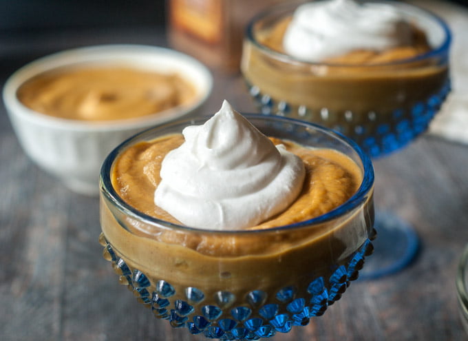 blue serving dishes for healthy pumpkin pie pudding with coconut whipped cream