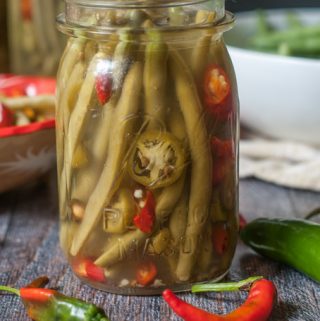 These spicy pickled green beans are my new obsession. Crunchy refrigerated pickled green beans that are both spicy and sweet and best of all, a nice low carb snack.