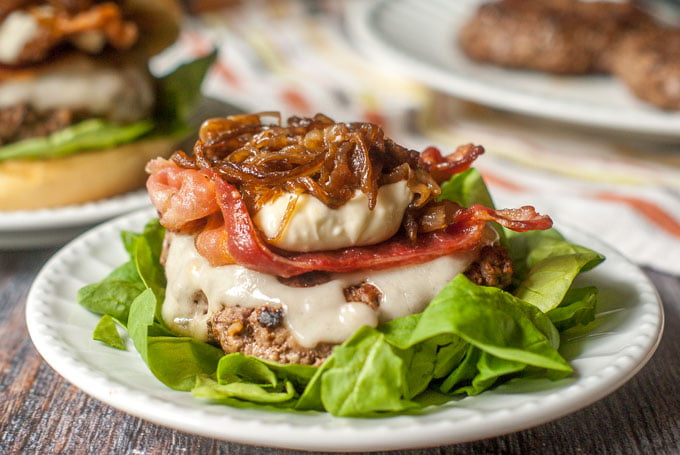 This decadent bacon cheeseburger with balsamic onions & garlic aioli is the perfect combination. Sweet onions, salty bacon, creamy Swiss and garlicky aioli make the perfect combination. Skip the bun to make it low carb! 