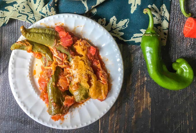 These cheesy chorizo stuffed chiles are an easy and tasty appetizer that's low carb too. The spicy chorizo and the melty cheese make these peppers a winner!