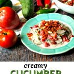 blue plates of creamy cucumber salad with tomatoes & bacon and text overlay