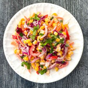 white plate with rainbow salad