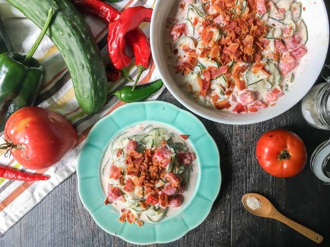 This ranch bacon cucumber & tomato salad is creamy and cool and has that salty crunch of bacon. A delicious way to use fresh tomatoes and cucumbers from the garden. 