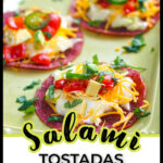 Closeup of a green platter with keto salami tostada bites and text.