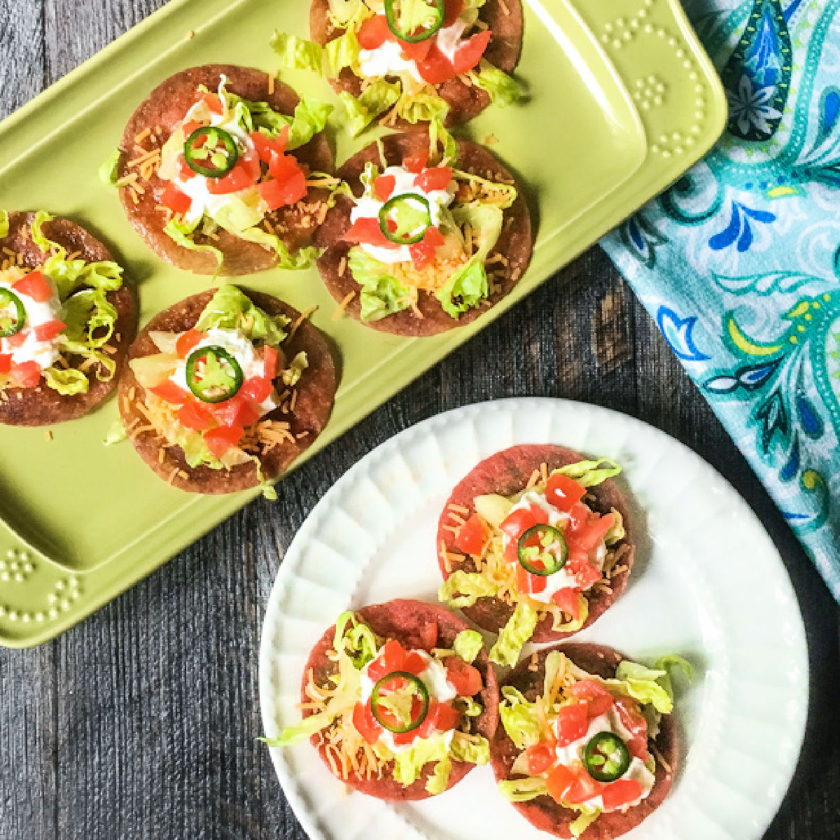 White plate and platter with low carb salami tostadas.