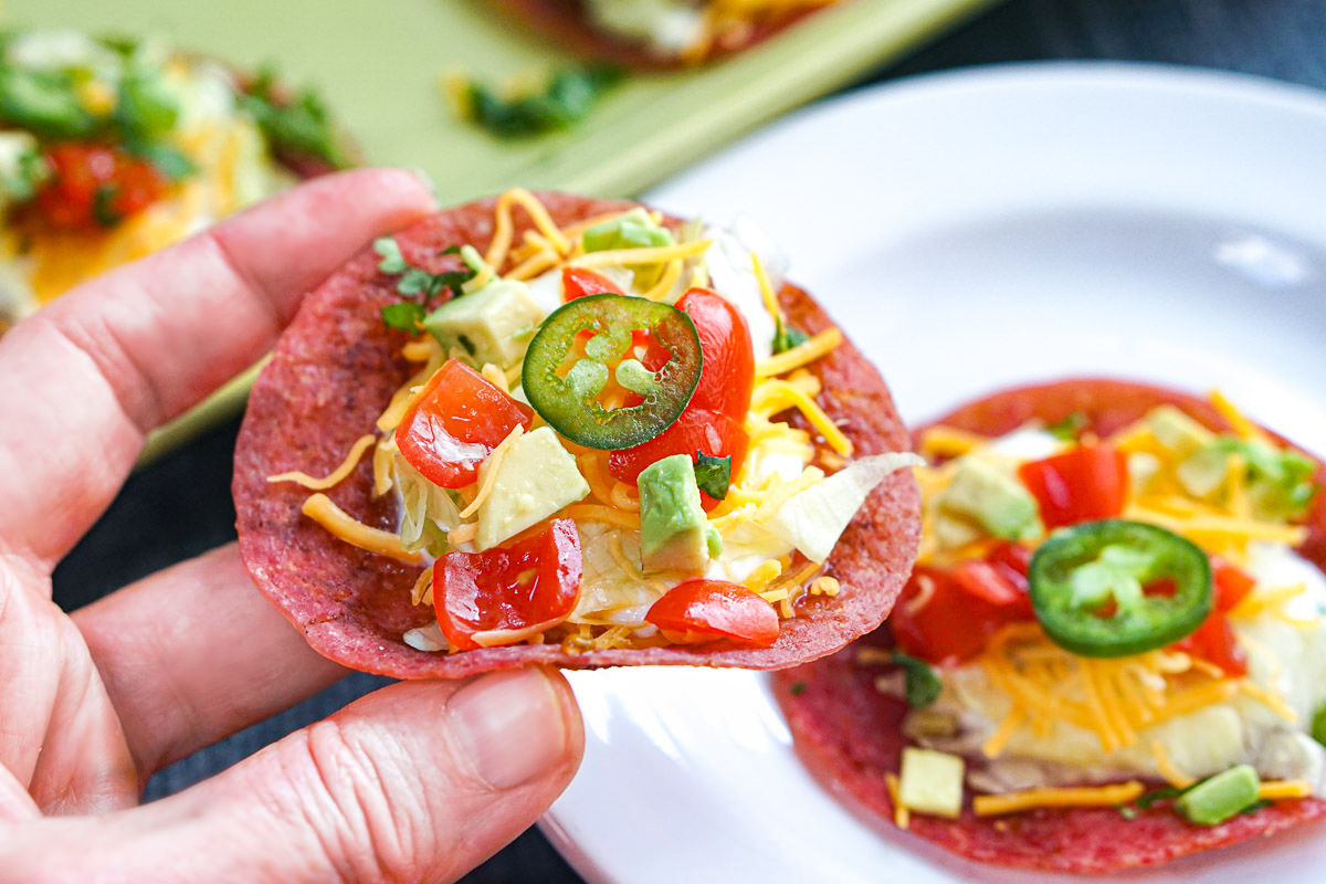 Fingers holding one of the finished snacks.