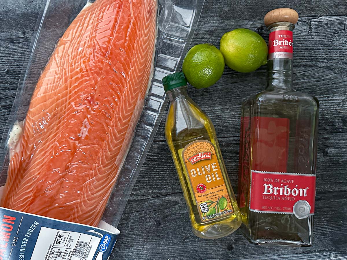 Lime Margarita Grilled Salmon - served with a garlicky avocado mayo for a tasty low carb dinner! Recipe ingredients - whole salmon filet, limes, olive oil and tequila.
