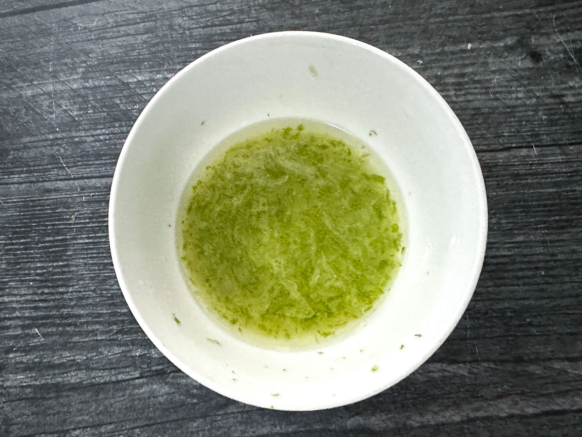 White bowl with the marinade mixed together.