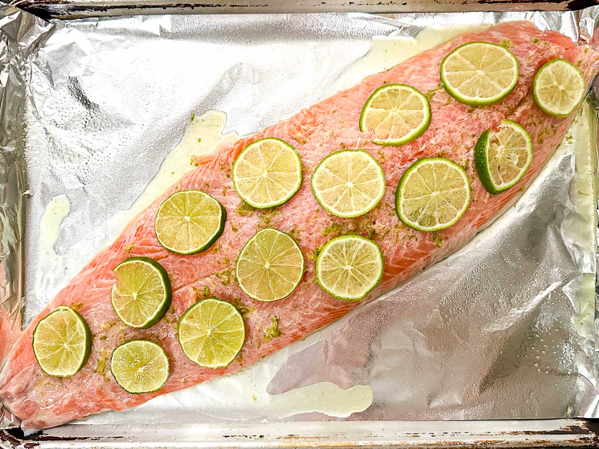Baking sheet covered in foil with the prepared fish ready to bake.