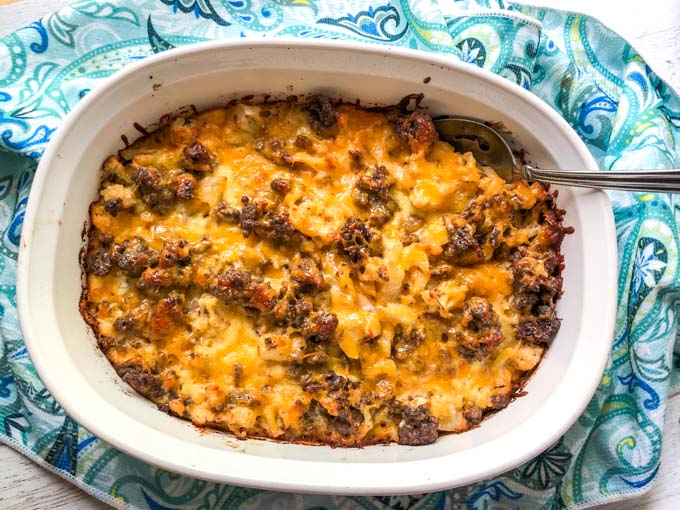baking dish with keto cheeseburger casserole and blue towel