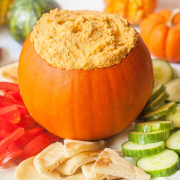 pumpkin filled with hummus and fresh veggies