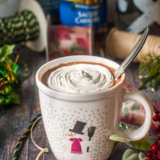 Santa's Little Helper - a low carb spiked cocoa is the perfect way to unwind during the holiday rush. Creamy, sweet and only 3.8g net carbs, you can drink this with or without alcohol to spread that holiday cheer!
