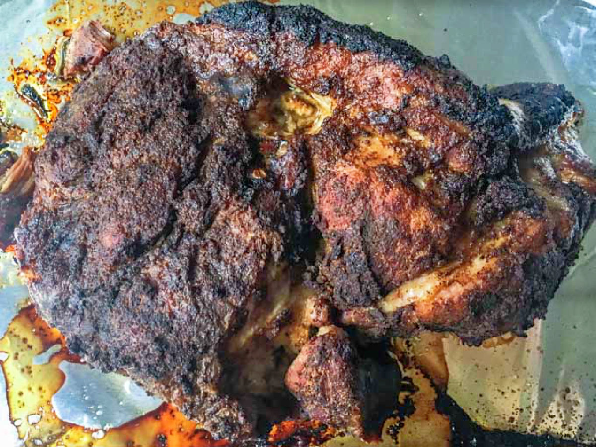 Slow Cooker Smokey Barbecue Pork - an easy low carb barbecue pork dish in the slow cooker! Baking sheet with a the crusty smoked pull pork roast after baking in the oven.