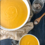 white bowls with creamy butternut squash soup and text