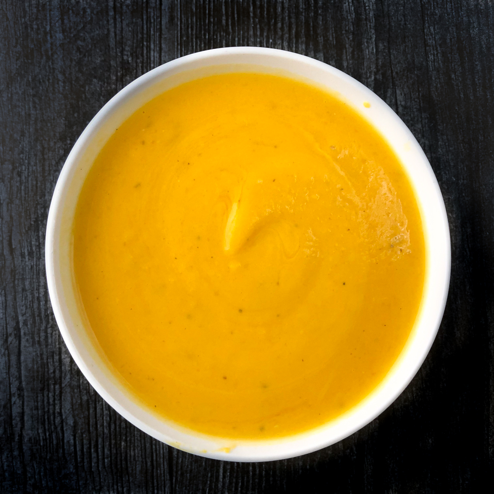 white bowl with pureed butternut squash soup