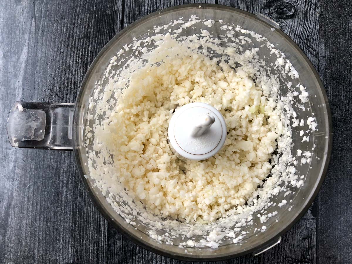 food processor bowl with riced cauliflower 