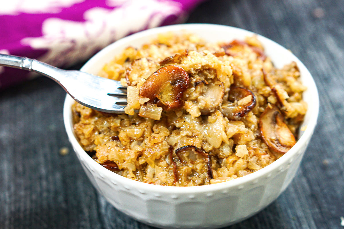 Closeup of a forkful of the cheesy brie mushroom cauli rice.