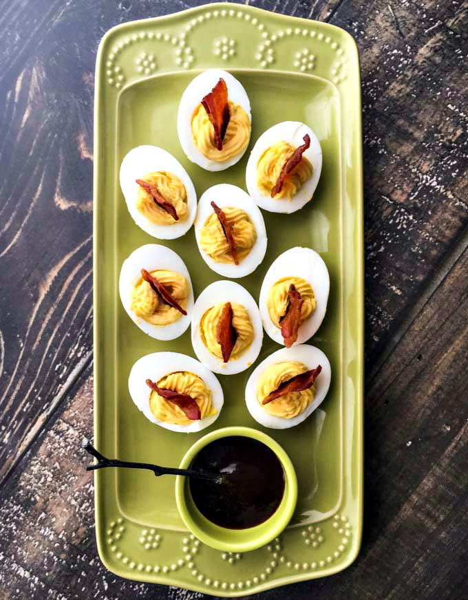 Try this delicious low carb appetizer of bbq bacon cheddar deviled eggs! A fun and tasty finger food that's super easy to make. Only 0.7g net carbs per serving.