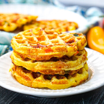 stack of low carb jalapeno cheddar waffles on white plate