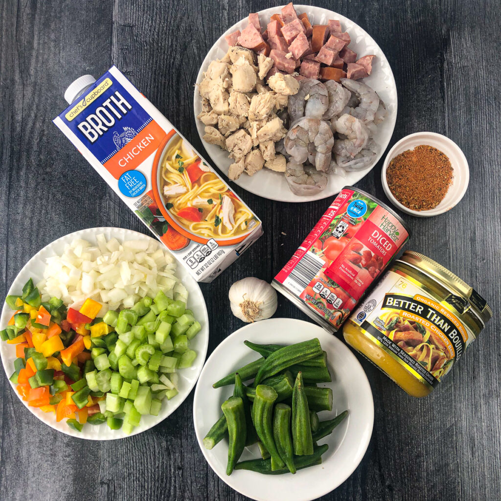 recipe ingredients - cooked chicken, kielbasa, shrimp, broth, cajun seasoning, dice tomatoes, okra, garlic and veggies