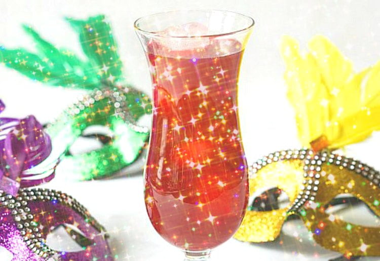 glittery pic of low carb hurricane drink with Mardi Gras masks around