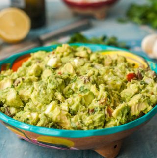 This chunky greek guacamole is a great low carb dip to take to a party or just add to your next Mexican feast. Briny olive, salty cheese, sweet tomatoes all wrapped up in creamy avocados. One serving is just 3.6g net carbs.
