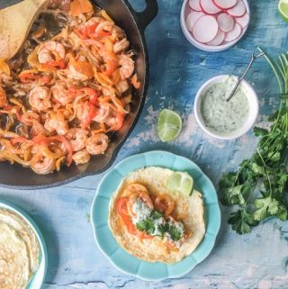 These low carb shrimp tacos taste wonderful with gluten free coconut tortillas or without anything at all. The southwestern flavors of lime, cumin and garlic go perfectly with the cilantro lime mayo topping. 