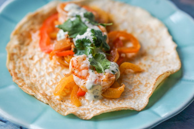 close up of a keto shrimp taco on gluten free tortilla made from coconut flour