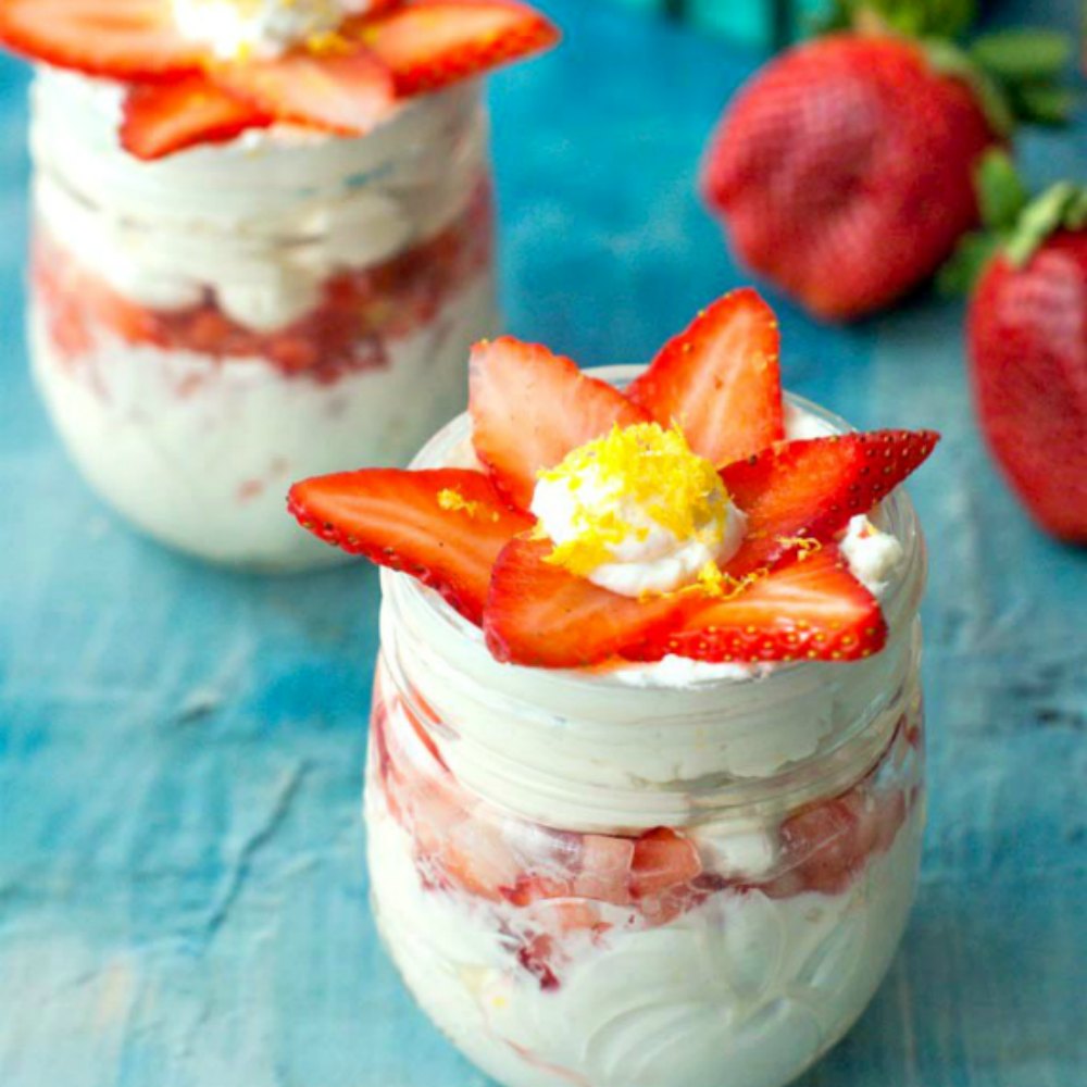 Closeup of a jar of keto lemon strawberry no bake cheesecake treats.