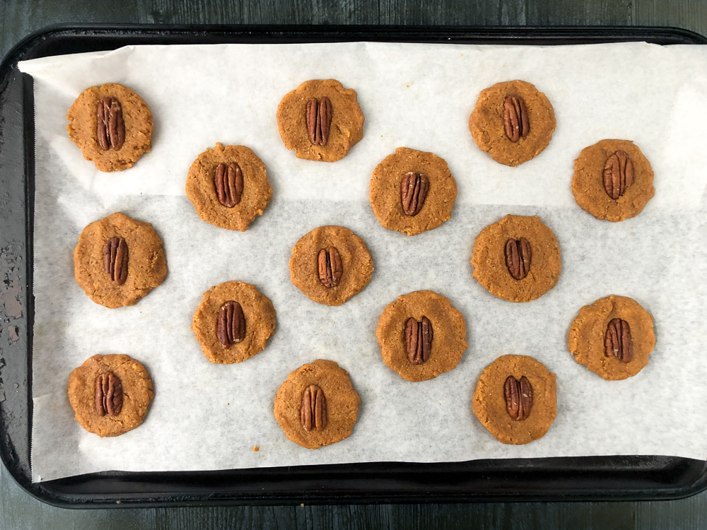 unbaked pecan pumpkin cookies on a cookie sheet