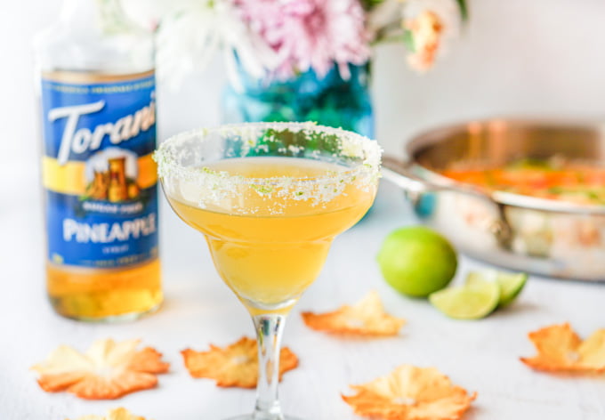 This spicy pineapple margarita is a festive, low carb drink that would be perfect for your next brunch or to pamper your mom on Mother's Day. Spicy infused tequila with sweet pineapple and tart lime make for a tasty drink. 