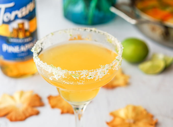 This spicy pineapple margarita is a festive, low carb drink that would be perfect for your next brunch or to pamper your mom on Mother's Day. Spicy infused tequila with sweet pineapple and tart lime make for a tasty drink. 