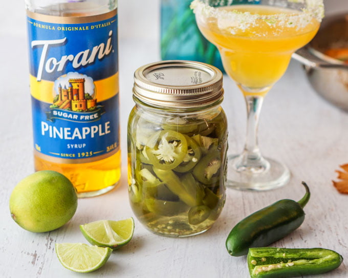 This spicy pineapple margarita is a festive, low carb drink that would be perfect for your next brunch or to pamper your mom on Mother's Day. Spicy infused tequila with sweet pineapple and tart lime make for a tasty drink. 