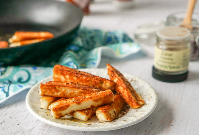 These za'atar halloumi cheese fries are a delicious low carb snack. Salty, briny halloumi cheese is simply pan fried and seasoned the bit of Middle Eastern za'atar spice. Only a few minutes to make, you will be crazy for this fried cheese snack.