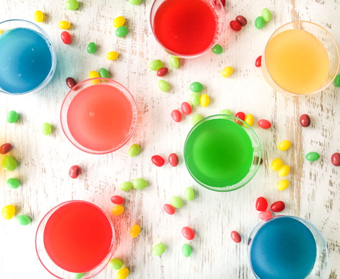 colorful keto jelly bean gelatin snacks with real jelly beans scattered around