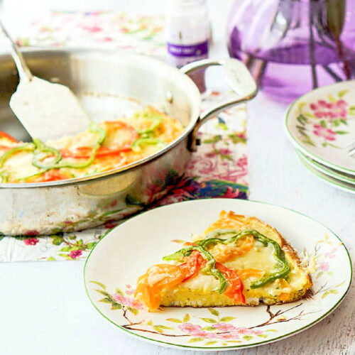 Pan and plate with some keto pepper and gruyere frittata.