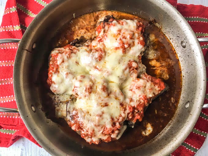 These cheesy pizza beef rollups are a fun and delicious low carb dinner you can make with one pan. Thin beef steaks are stuffed with melty, gooey cheese and topped with low carb sauce to make a tasty weeknight meal.