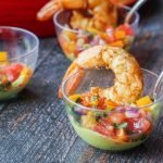 This Mexican shrimp cocktail is the perfect low carb appetizer for Cinco de Mayo! Each cup is filled with a creamy avocado dip, refreshing pico de gallo and 2 large spicy shrimp. Each serving has only 2.0g net carbs. 